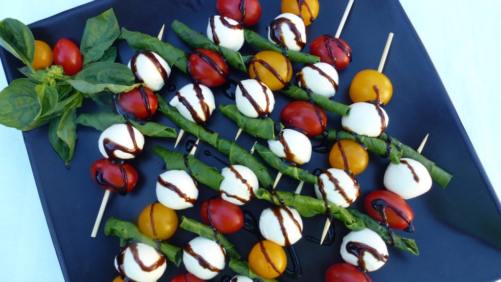 A beautiful tray of bocconcini cherry tomato skewers