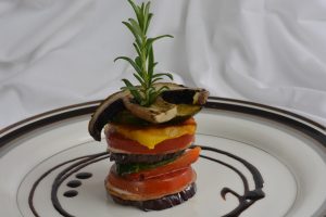 Vegetable Stacks with a balsamic glaze swirl.