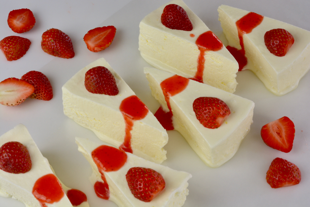 Wedges of Lemon Kulfi topped with strawberry sauce to end an East Indian menu.