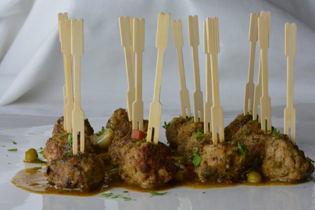 Meatballs in Almond Sauce served as an appetizer with toothpicks