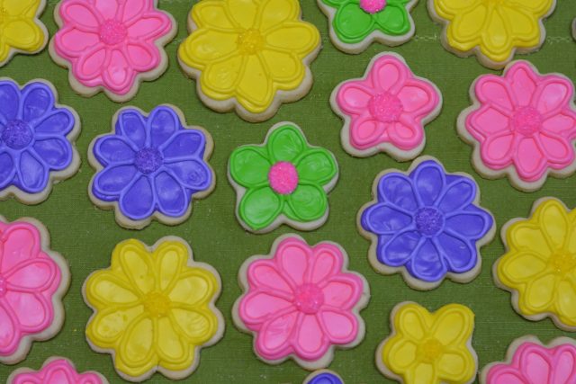 Brightly coloured royal icing on Gluten Free Sugar Cookies
