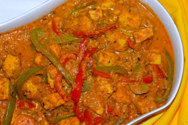 Gluten Free Paneer and Peppers in Fragrant Gravy in a serving dish