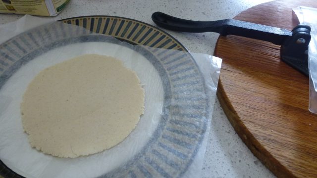 Just pressed gluten free corn tortillas ready to be fried.