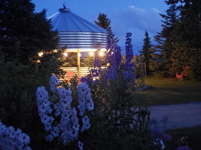 An evening view of a modern granary used as an Outdoor Dining Area