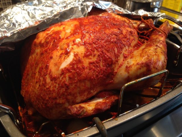 Gluten Free Achiote Butter Basted Turkey in the roasting pan.