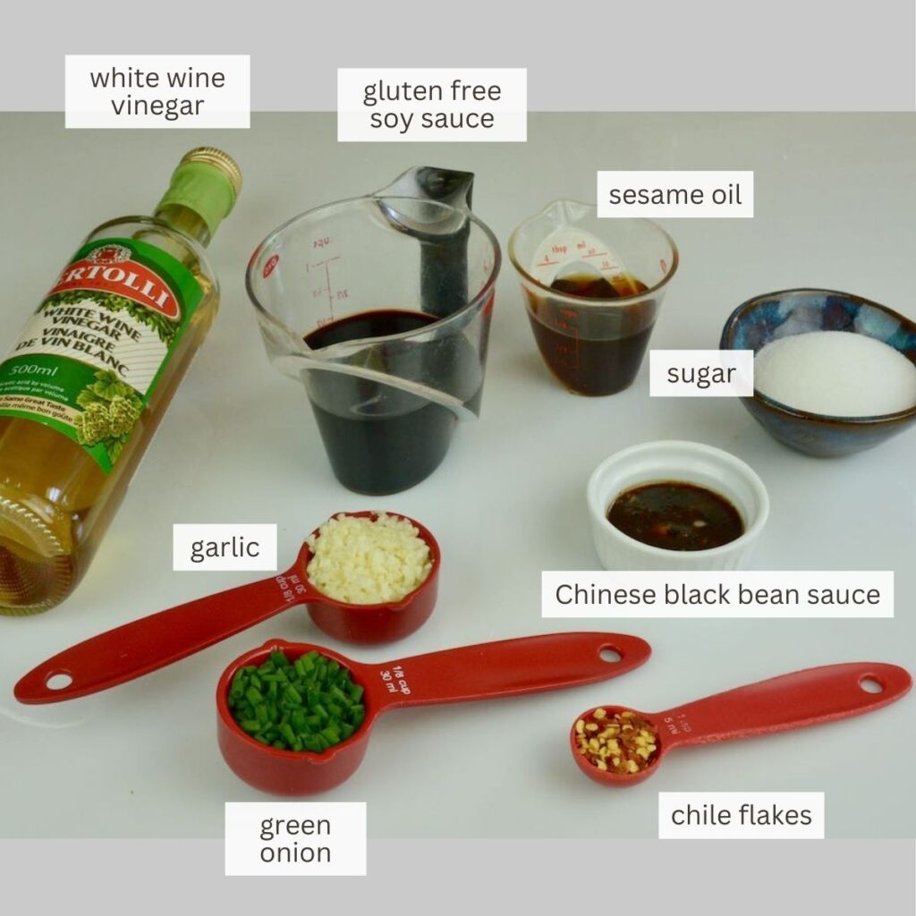 Measuring cups and spoons with all the ingredients for Mongolian Pork Chops.
