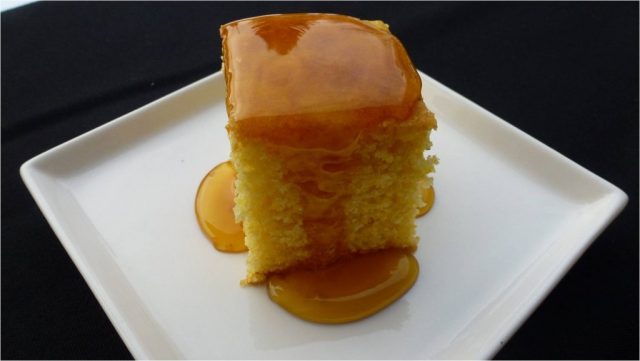 A plate of gluten free cornbread covered in corn syrup