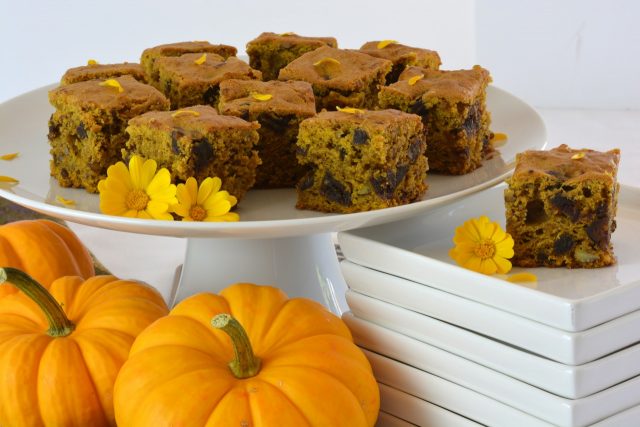 Pumpkin Date Cake on a pedestal tray garnished with calendula petals.