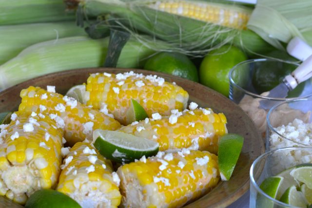 A serving dish of Corn with Feta and Lime ready to eat.