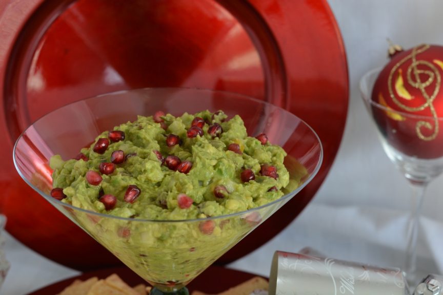 An oversized martini glass filled with Pomegranate Pear Guacamole.
