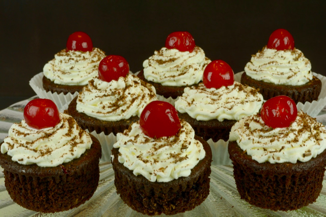 A pedestal tray displaying Black Forest Cupcakes