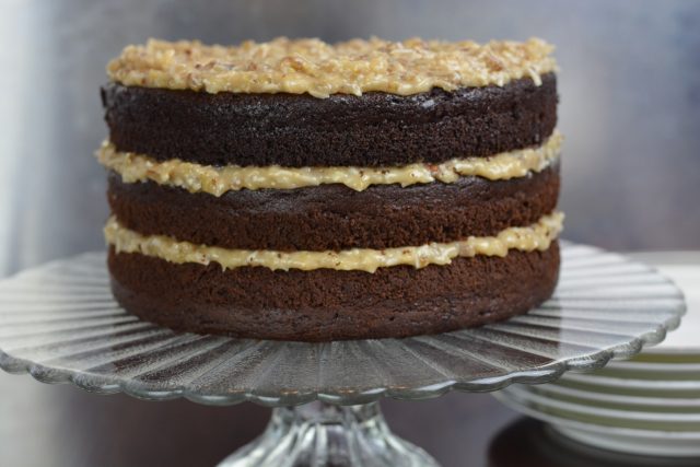 German Chocolate Cake on a pedestal tray.