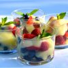 Little dishes of fresh berries topped with homemade lemon curd.