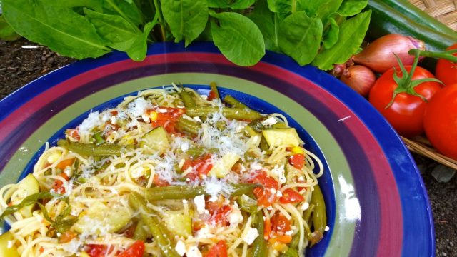 A bowl of pasta with fresh sorrel and feta