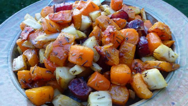 A serving dish of naturally gluten free roasted root vegetables.