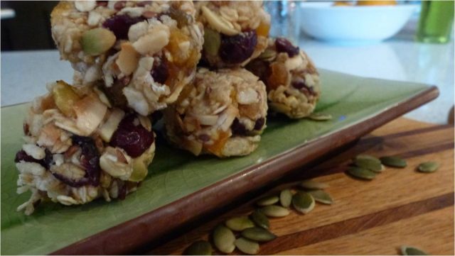 Gluten Free Energy Balls stacked on a plate.