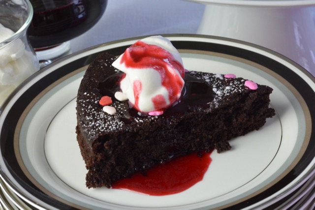 A piece of quinoa chocolate cake with Valentine's sprinkles.