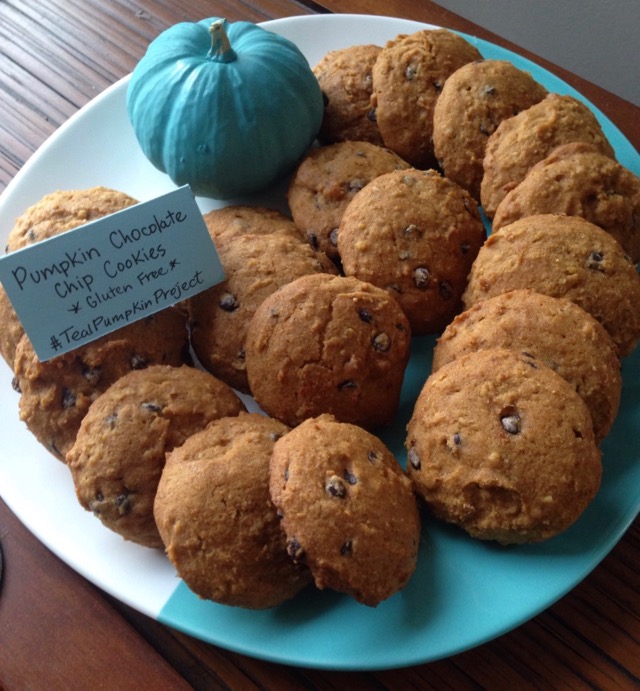 Pumpkin Chocolate Chip Cookies on teal plate with a mini teal pumpkin.