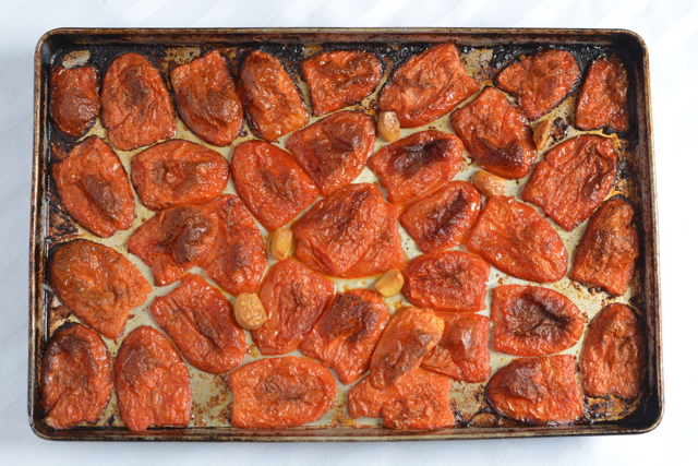 A pan of roasted tomatoes and garlic