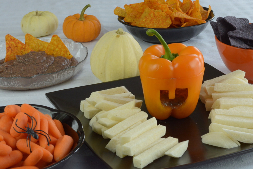 Black Bean Dip served in a orange pepper cut to look like a jack-o'-lantern.