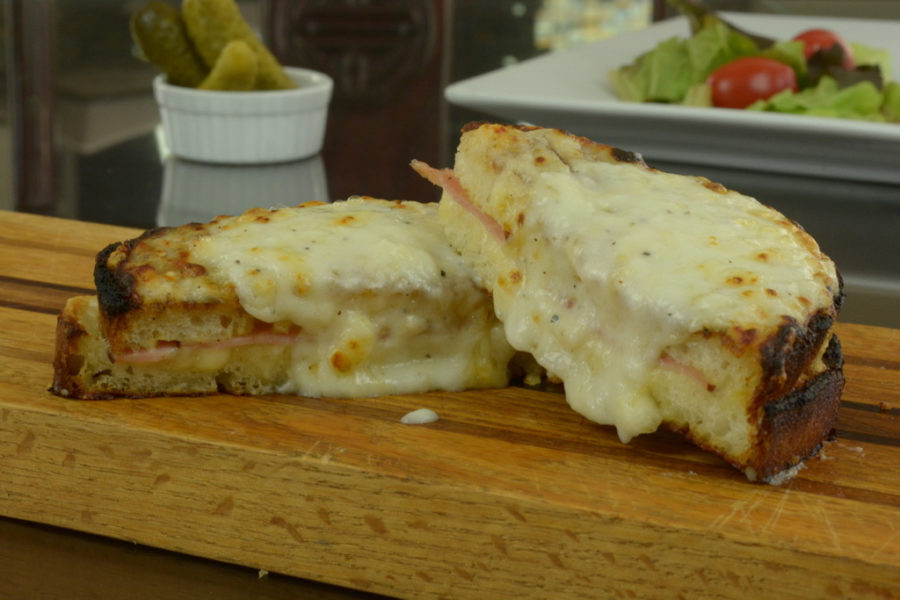 Croque Monsieur, the famous French sandwich made with ham and Swiss cheese topped with white sauce.