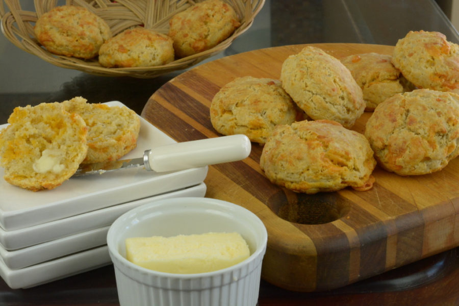 Gluten free Cheese Biscuits on a board served with extra butter.