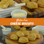 A board with Cheese Biscuits beside a plate with one biscuit cut and a dish of butter.