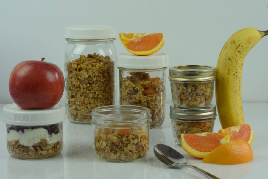 Gluten Free Pistachio Apricot Granola portioned into different sizes of Mason jars and ready to eat.