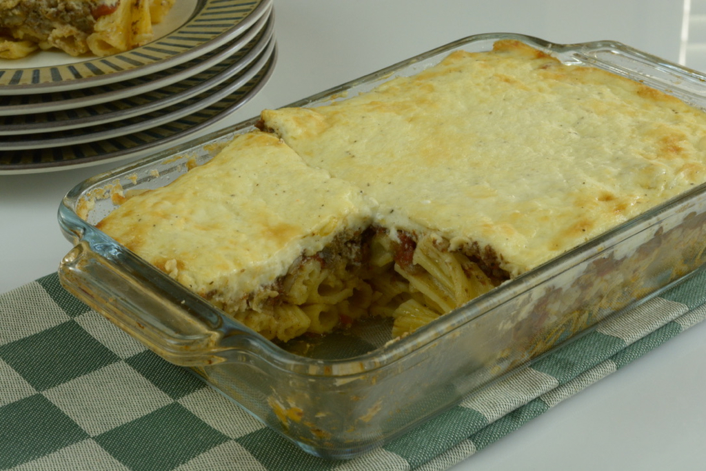 A dish of baked Pastitsio; noodles, meat sauce and white sauce.