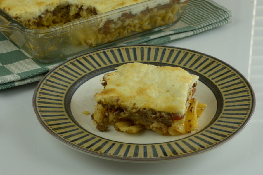 Greek Pastitsio, a layered main course dish with pasta, meat sauce and white sauce.