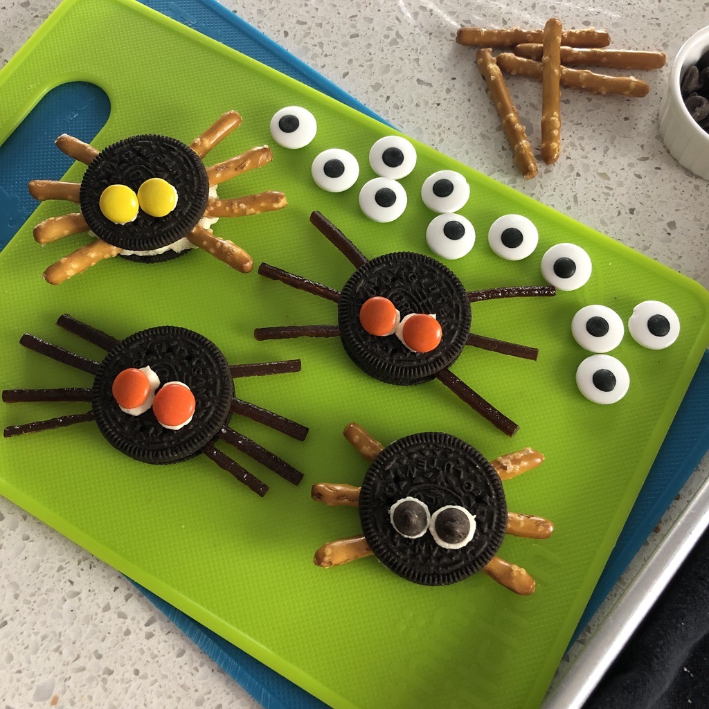 These easy homemade Halloween treats are Cookie Spiders with candy eyes and legs of fruit or pretzel sticks.