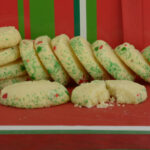 Rolled Shortbread with holiday sprinkles on a Christmas box