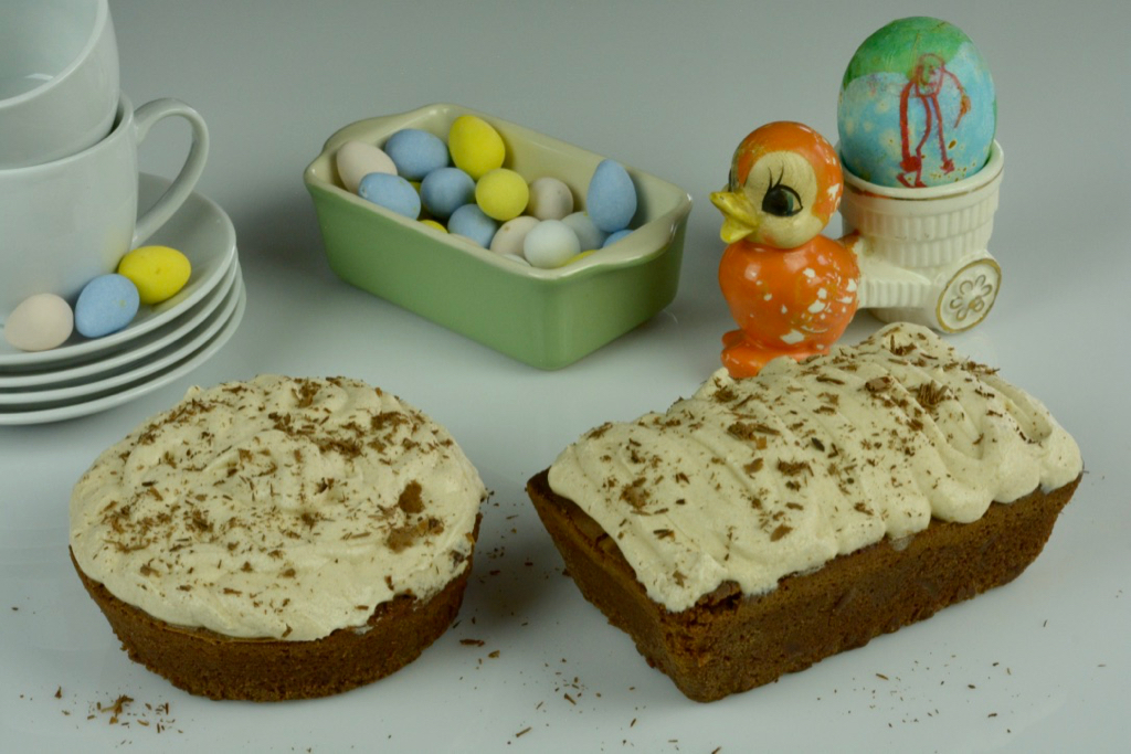 Two small Dairy Free Cappuccino Brownies, one round and one mini loaf with candy Easter Eggs to decorate them.
