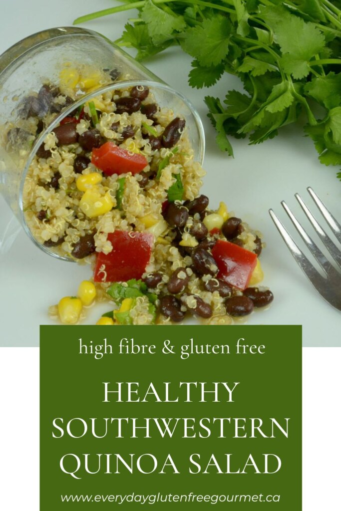 A dish of healthy Southwestern Quinoa Salad spilling out onto the counter with cilantro beside it.