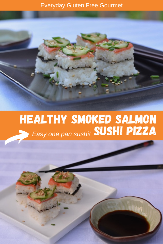 A black tray with small square pieces of Smoked Salmon Sushi Pizza.