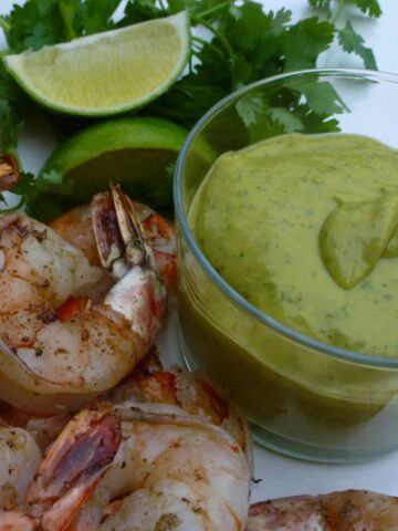 A dish of Avocado Chipotle Sauce with grilled shrimp.