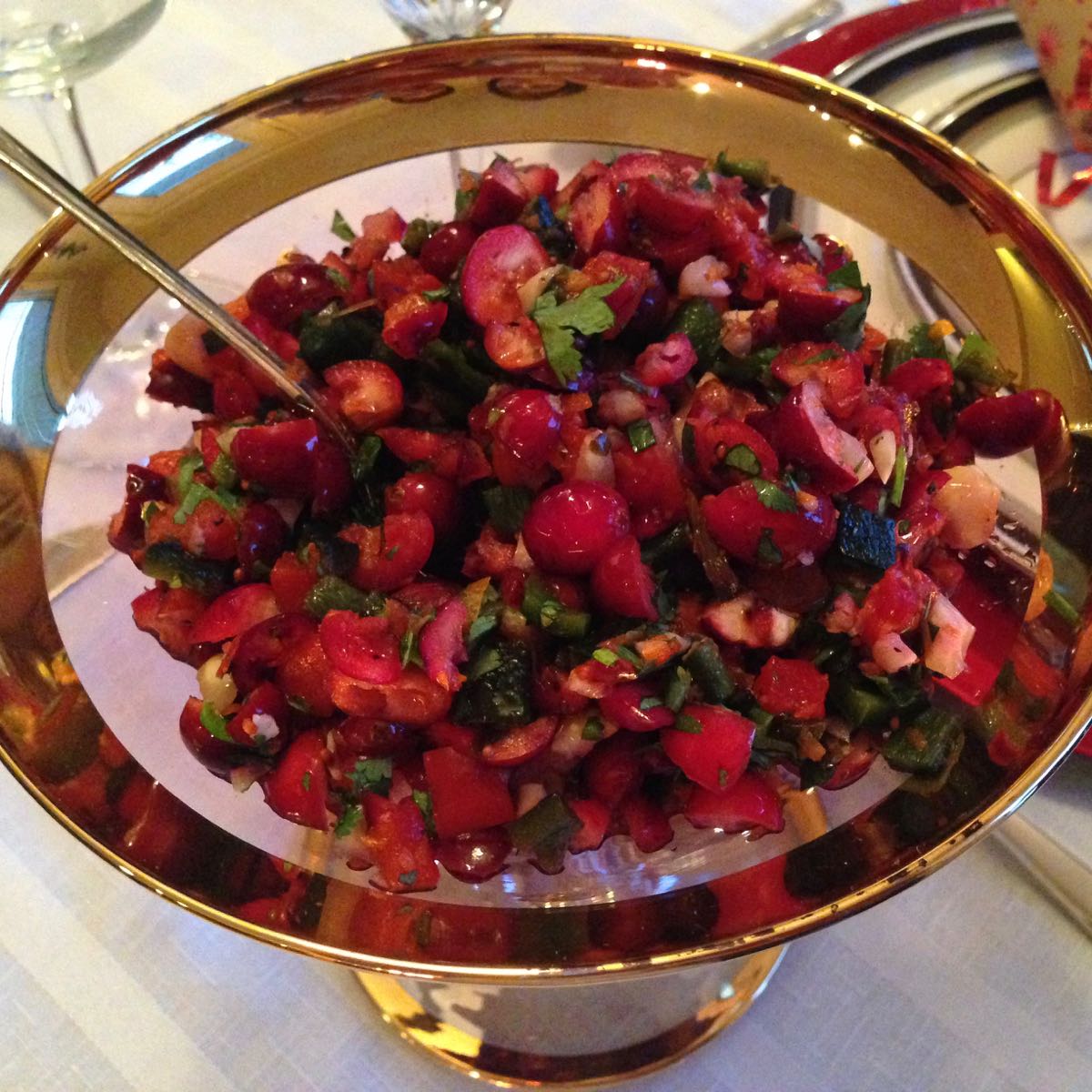 A dish of gluten free cranberry orange and cilantro salsa.