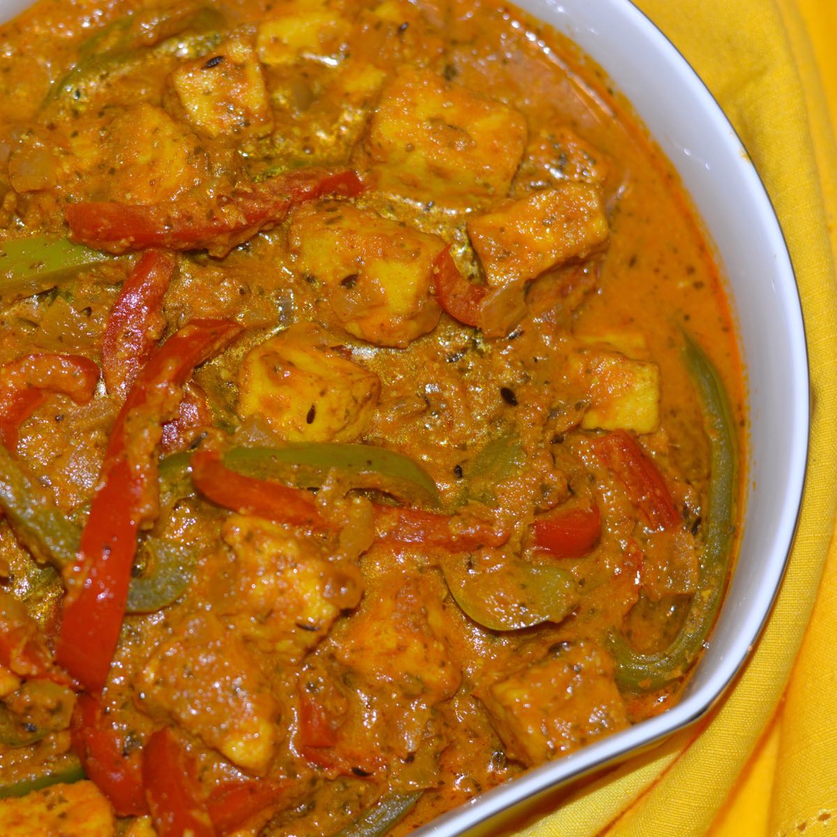 A dish of Paneer and Peppers in Fragrant Gravy.