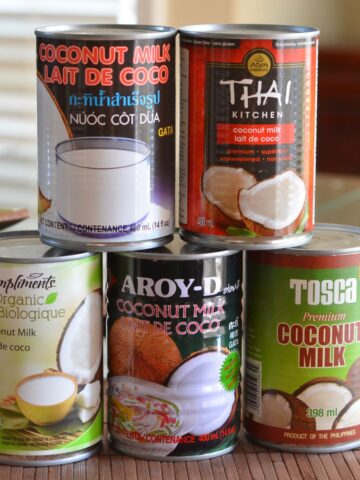 Five different brands of canned coconut milk.