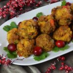 A plate piled with Cornbread Sausage Stuffing Balls.