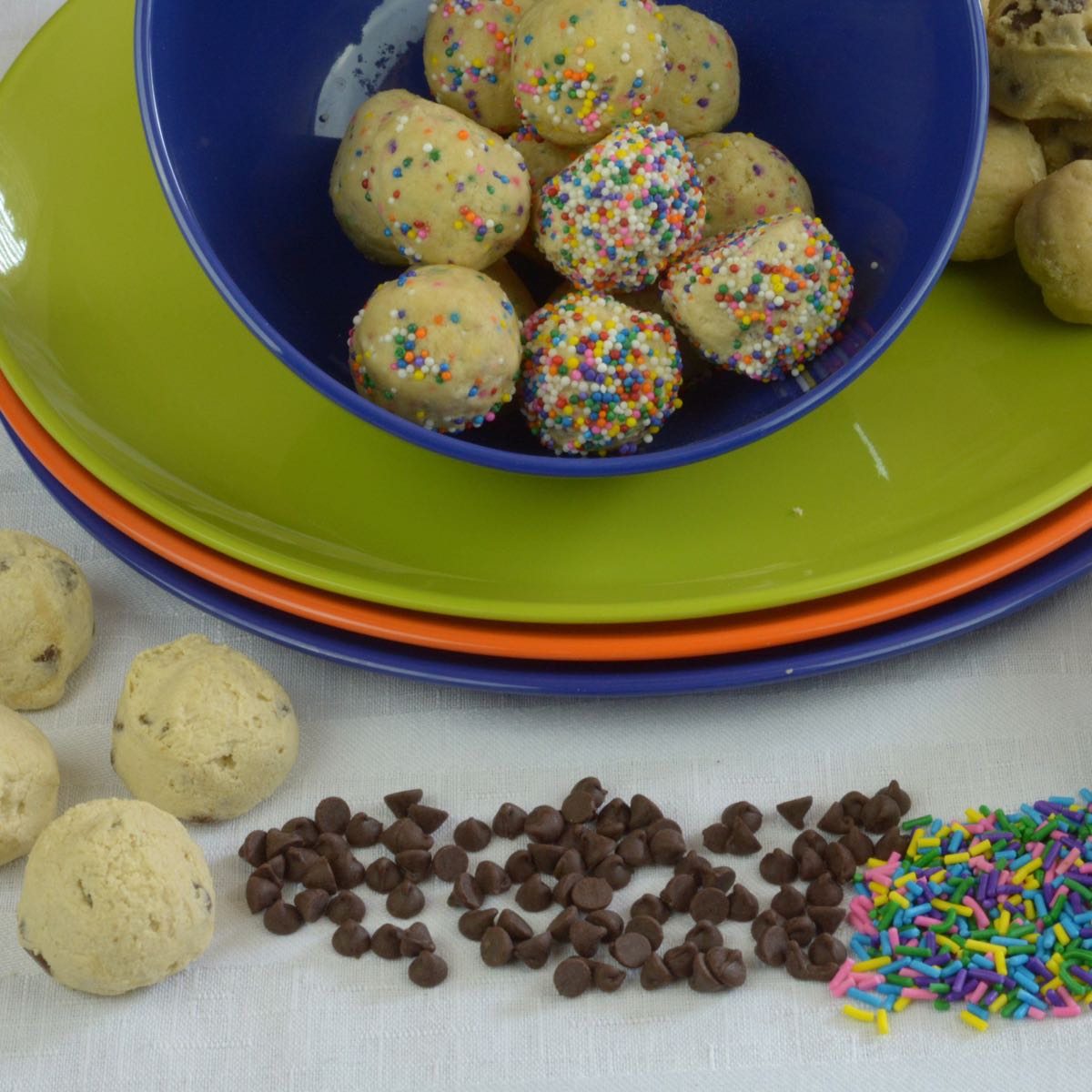 Gluten free Edible Cookie Dough Balls covered in rainbow sprinkles are fun for kids and can be made dairy free.