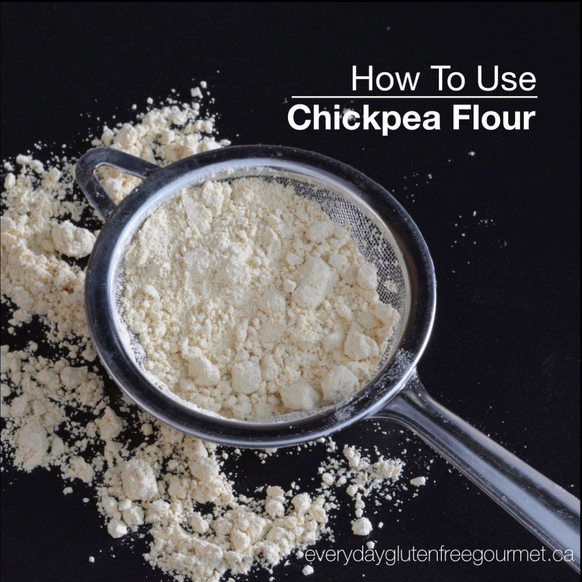 A black background with a small strainer filled with chickpea flour and some sifted flour around it.