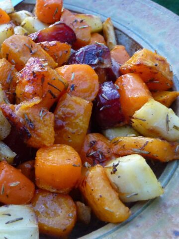 A serving dish of naturally gluten free roasted root vegetables.
