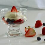 Gluten free Vanilla Cream with fresh fruit served in a variety of glassware.