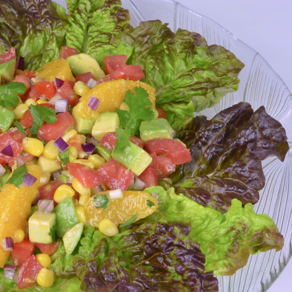 A lettuce lined platter of Mexican Avocado Orange Salad.