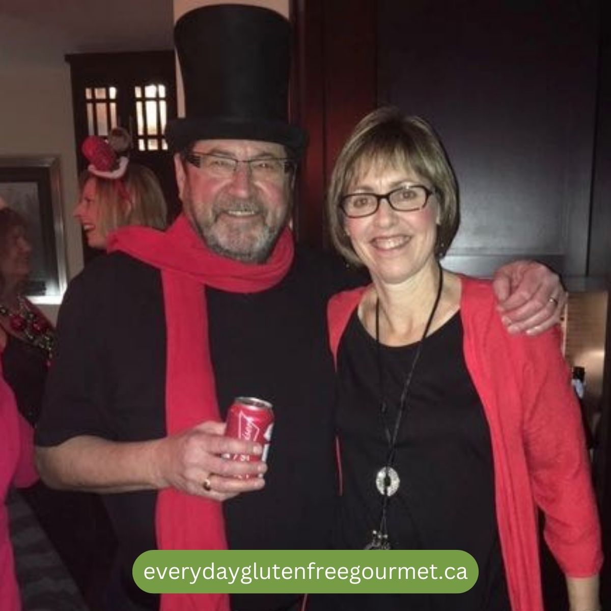 Cinde and Jim dressed in black and red at their Kitchen Party.