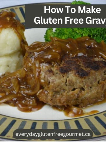 A plate with Salisbury steak and mashed potatoes covered in gluten free onion gravy.