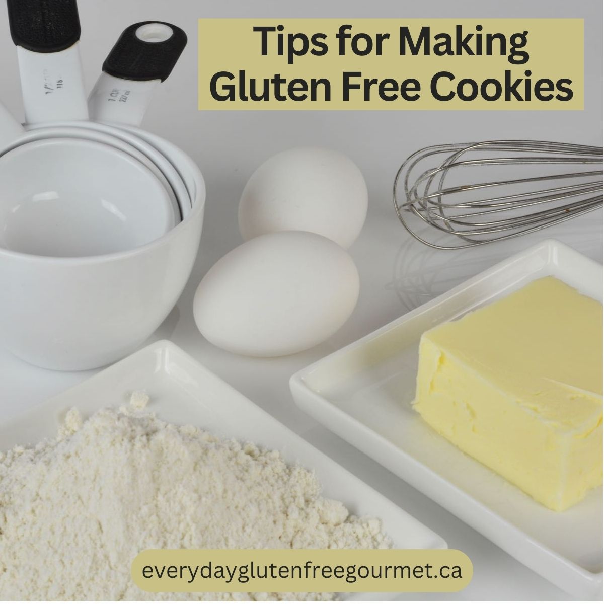 Measuring cups, eggs, butter and flour.