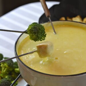 Gluten Free Swiss Cheese Fondue with forks loaded and ready to dip.