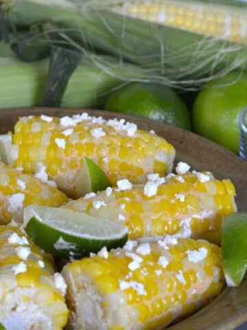 A serving dish of Corn with Feta and Lime ready to eat.